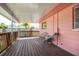Spacious covered porch with two chairs and a wooden floor, perfect for outdoor relaxation at 11225 59Th Ave, Seminole, FL 33772