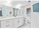 Bright bathroom featuring modern vanity, updated fixtures, and tile shower at 11225 59Th Ave, Seminole, FL 33772