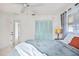 Serene bedroom features stylish lamps, bedside tables, and cool coastal color palette at 11225 59Th Ave, Seminole, FL 33772