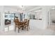 Open-concept living space with a dining table and tile flooring at 11225 59Th Ave, Seminole, FL 33772