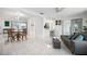 Inviting open-concept living space with tile flooring, dining area, and kitchen access at 11225 59Th Ave, Seminole, FL 33772