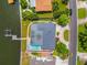 Overhead view of the home showing the roof, pool, dock, landscaping, and proximity to the water at 1124 35Th Ne Ave, St Petersburg, FL 33704