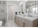 Bright bathroom featuring double vanity, marble counters, new fixtures, and a glass-enclosed shower at 1124 35Th Ne Ave, St Petersburg, FL 33704