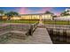 This backyard offers deep water access, a wooden dock, and a modern home for waterfront enjoyment at 1124 35Th Ne Ave, St Petersburg, FL 33704