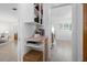 Hallway with built-in shelving and seamless flow to living area at 1124 35Th Ne Ave, St Petersburg, FL 33704
