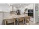 Well-equipped kitchen featuring modern appliances, granite countertops, and sleek white cabinetry at 1124 35Th Ne Ave, St Petersburg, FL 33704