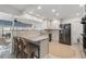Modern kitchen featuring granite countertops, stainless steel appliances, and a casual breakfast bar at 1124 35Th Ne Ave, St Petersburg, FL 33704