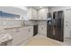 Charming kitchen boasting stainless steel appliances, granite countertops, and ample white cabinetry at 1124 35Th Ne Ave, St Petersburg, FL 33704