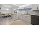 Open-concept kitchen area with granite countertops, stainless steel appliances, and adjacent dining area at 1124 35Th Ne Ave, St Petersburg, FL 33704