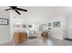 Inviting living room featuring a ceiling fan, white sofa, shutters, and stylish, contemporary furnishings at 1124 35Th Ne Ave, St Petersburg, FL 33704