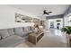 Open-concept living room with comfortable seating, natural light, and seamless flow to other living spaces at 1124 35Th Ne Ave, St Petersburg, FL 33704