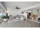 Spacious living room with open layout, view to the kitchen, dining room, bedroom, and outdoor living area at 1124 35Th Ne Ave, St Petersburg, FL 33704