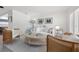 Bright living room with white sofa, modern furniture, and natural light at 1124 35Th Ne Ave, St Petersburg, FL 33704