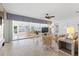 Bright living room with sliding glass doors, ceiling fan, comfortable seating and a view of the water at 1124 35Th Ne Ave, St Petersburg, FL 33704
