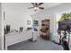 Bright office space with desk, exercise equipment, and view of the pool at 1124 35Th Ne Ave, St Petersburg, FL 33704