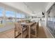Enclosed patio with dining area overlooking the water with many windows at 1124 35Th Ne Ave, St Petersburg, FL 33704