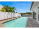 Stunning private pool and patio with lush landscaping, offering a relaxing waterfront retreat at 1124 35Th Ne Ave, St Petersburg, FL 33704