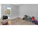 Minimalist bedroom with a window and carpeted floor at 11819 Brighton Knoll Loop, Riverview, FL 33579