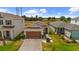 Charming single-story home featuring a well-manicured lawn, brick driveway, and attached two-car garage at 11819 Brighton Knoll Loop, Riverview, FL 33579