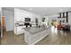 Spacious kitchen with island, stainless appliances, and open layout, connecting living & dining spaces at 11819 Brighton Knoll Loop, Riverview, FL 33579