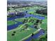 Stunning aerial view of the lush community showcasing manicured fairways and shimmering water features at 1200 Country Club Dr # 5506, Largo, FL 33771