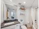 Bright bathroom features a granite vanity and tub-shower combination at 1200 Country Club Dr # 5506, Largo, FL 33771