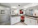 Modern bathroom with double vanity, large mirrors, and a tiled shower at 1200 Country Club Dr # 5506, Largo, FL 33771