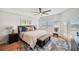 Comfortable main bedroom with ceiling fan, plush rug and large window with blinds at 1200 Country Club Dr # 5506, Largo, FL 33771