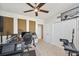 Bedroom featuring acoustic panels, ceiling fan and double closet doors at 1200 Country Club Dr # 5506, Largo, FL 33771