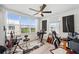 Bedroom featuring large windows, ceiling fan, and carpeted floor at 1200 Country Club Dr # 5506, Largo, FL 33771