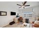 Bedroom setup as an office with a desk, computer, and television at 1200 Country Club Dr # 5506, Largo, FL 33771