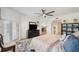 Comfortable main bedroom with ceiling fan and television console at 1200 Country Club Dr # 5506, Largo, FL 33771