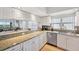 Kitchen with granite countertops, white cabinets, and stainless-steel appliances at 1200 Country Club Dr # 5506, Largo, FL 33771