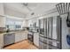 Updated kitchen featuring stainless steel appliances, sleek countertops, and bright, white cabinetry for a clean, modern feel at 1200 Country Club Dr # 5506, Largo, FL 33771