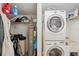 Well-equipped laundry room with washer, dryer, shelving, and storage solutions at 1200 Country Club Dr # 5506, Largo, FL 33771