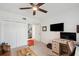 Comfortable carpeted living room setup with desk and leather sofa at 1200 Country Club Dr # 5506, Largo, FL 33771
