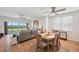 Open concept living area with wood floors, fan, and view to the golf course at 1200 Country Club Dr # 5506, Largo, FL 33771