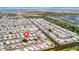 Aerial view of the community showcases waterfront homes and nearby amenities at 123 Saint Kitts Way, Apollo Beach, FL 33572