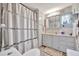 Neutral bathroom with a shower/tub combination with a privacy curtain and a vanity area at 123 Saint Kitts Way, Apollo Beach, FL 33572