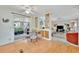 Bright dining area features a glass table, ceiling fan, and sliding doors to a sunroom at 123 Saint Kitts Way, Apollo Beach, FL 33572