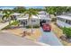 Charming single Gathering home with a well-manicured lawn and a two car covered parking spot at 123 Saint Kitts Way, Apollo Beach, FL 33572