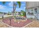 The front yard features a decorative rock and water garden, and a cozy porch at 123 Saint Kitts Way, Apollo Beach, FL 33572