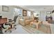 Inviting living room with a sofa, a desk, and a geometric patterned rug at 123 Saint Kitts Way, Apollo Beach, FL 33572