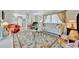 Cozy living room with a ceiling fan, comfortable seating arrangement, and a floral area rug at 123 Saint Kitts Way, Apollo Beach, FL 33572