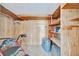 Large storage area with shelving and a rolling walker inside of the room at 123 Saint Kitts Way, Apollo Beach, FL 33572