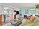 Bright sunroom with sliding door access and comfortable seating at 123 Saint Kitts Way, Apollo Beach, FL 33572