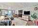 Enclosed sunroom with comfortable seating, sliding glass doors, and outdoor views at 123 Saint Kitts Way, Apollo Beach, FL 33572