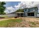 Spacious backyard featuring a white pergola and a fire pit at 12628 White Bluff Rd, Hudson, FL 34669