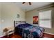 Comfortable bedroom with wood floors and a bedside table at 12628 White Bluff Rd, Hudson, FL 34669
