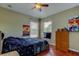 Cozy bedroom with a ceiling fan and two windows for lots of light at 12628 White Bluff Rd, Hudson, FL 34669